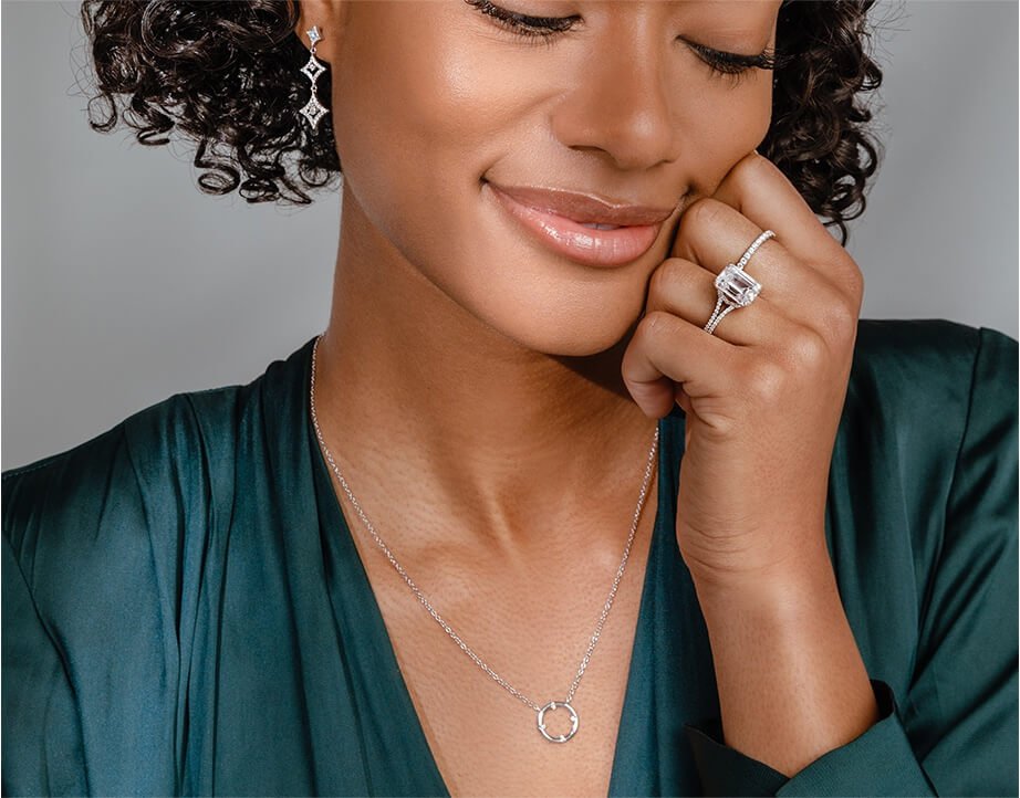 Woman wearing diamond jewelry and rings