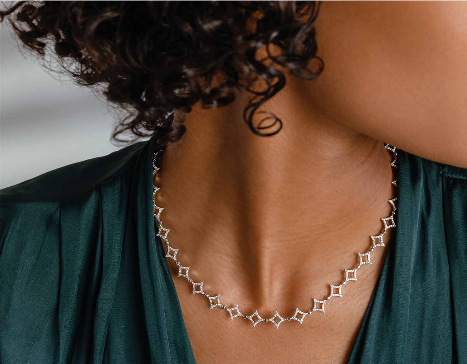Woman wearing distinctive diamond necklace