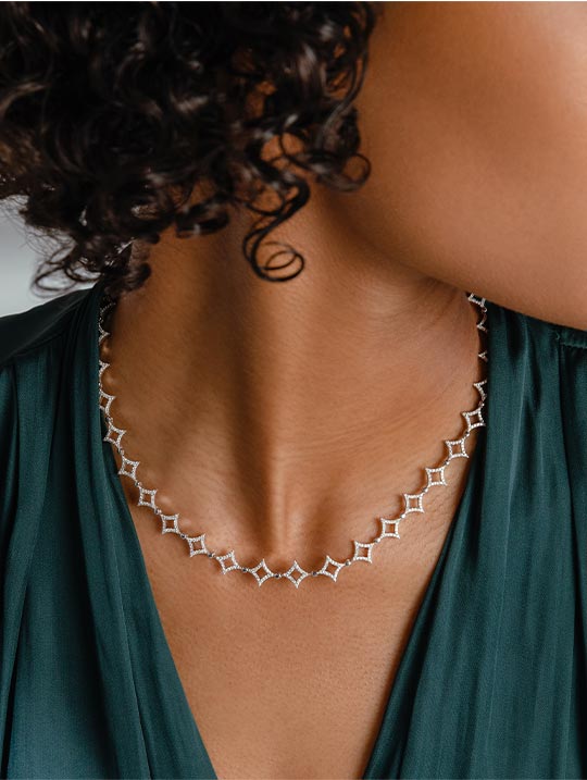 Woman wearing distinctive diamond necklace