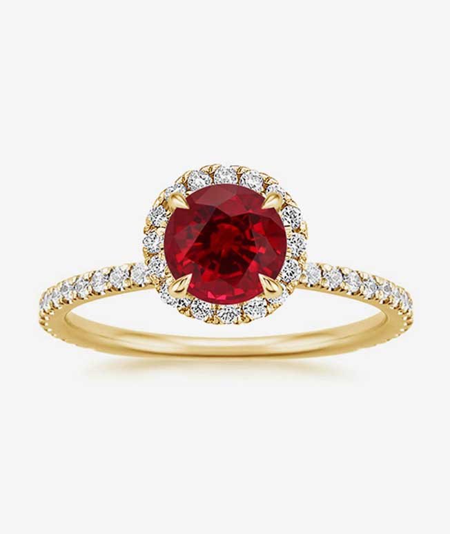 Yellow gold diamond halo ring with ruby