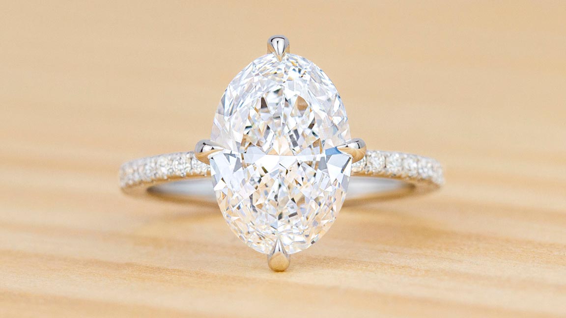 Unique white gold oval diamond engagement ring.
