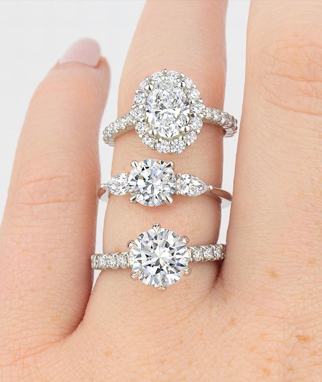 Stack of 3 luxe lab created diamond engagement rings.
