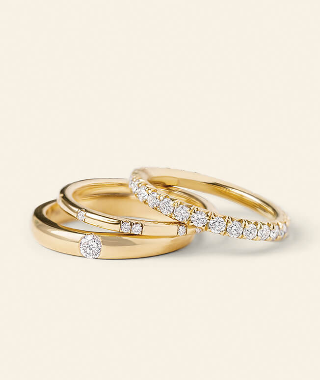 Three yellow gold diamond promise rings
