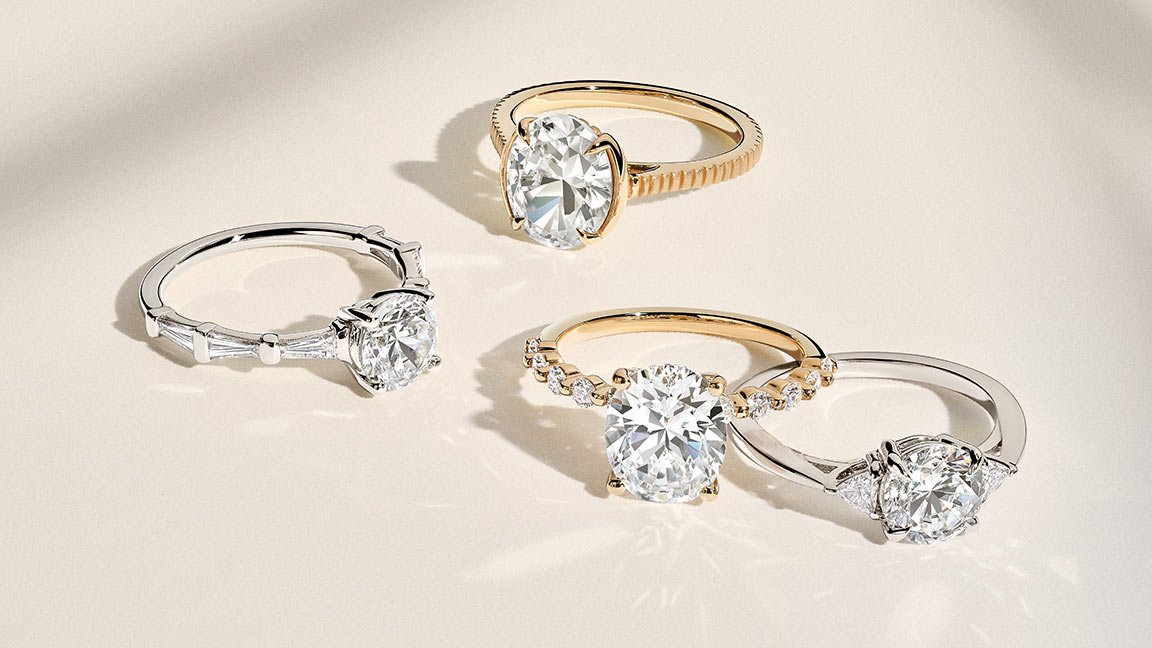 Variety of women's yellow gold and silver diamond engagement rings.