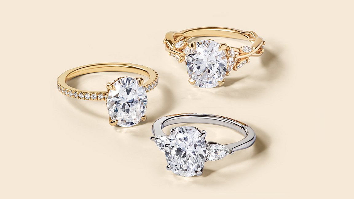 Variety of accented, oval, diamond engagement rings.