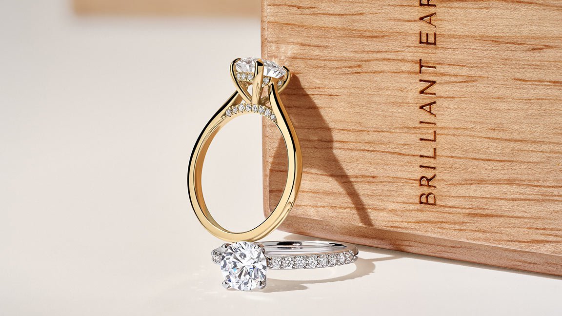 pair of gold diamond engagement rings.