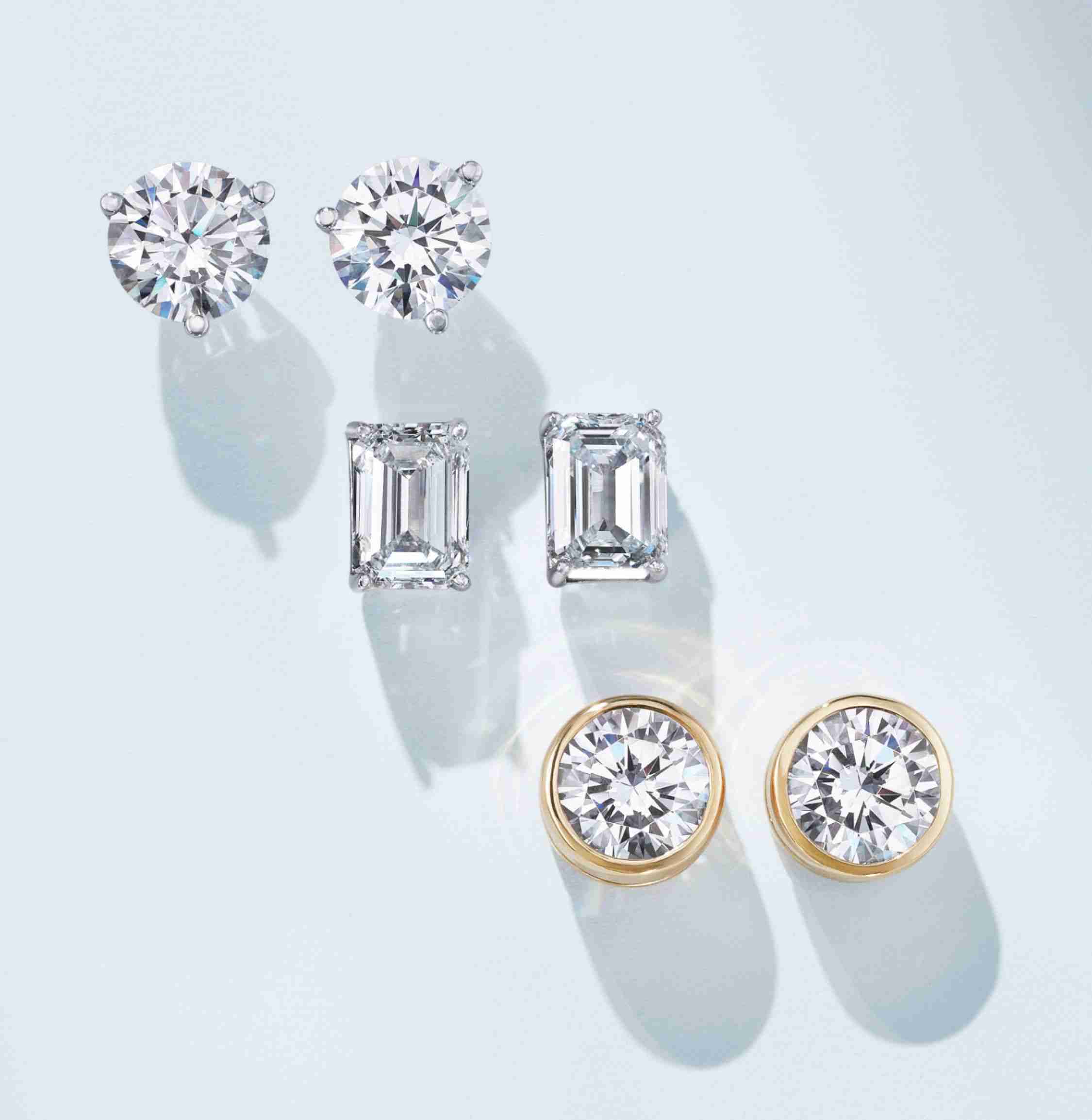 Diamond stud earrings in a variety of settings.