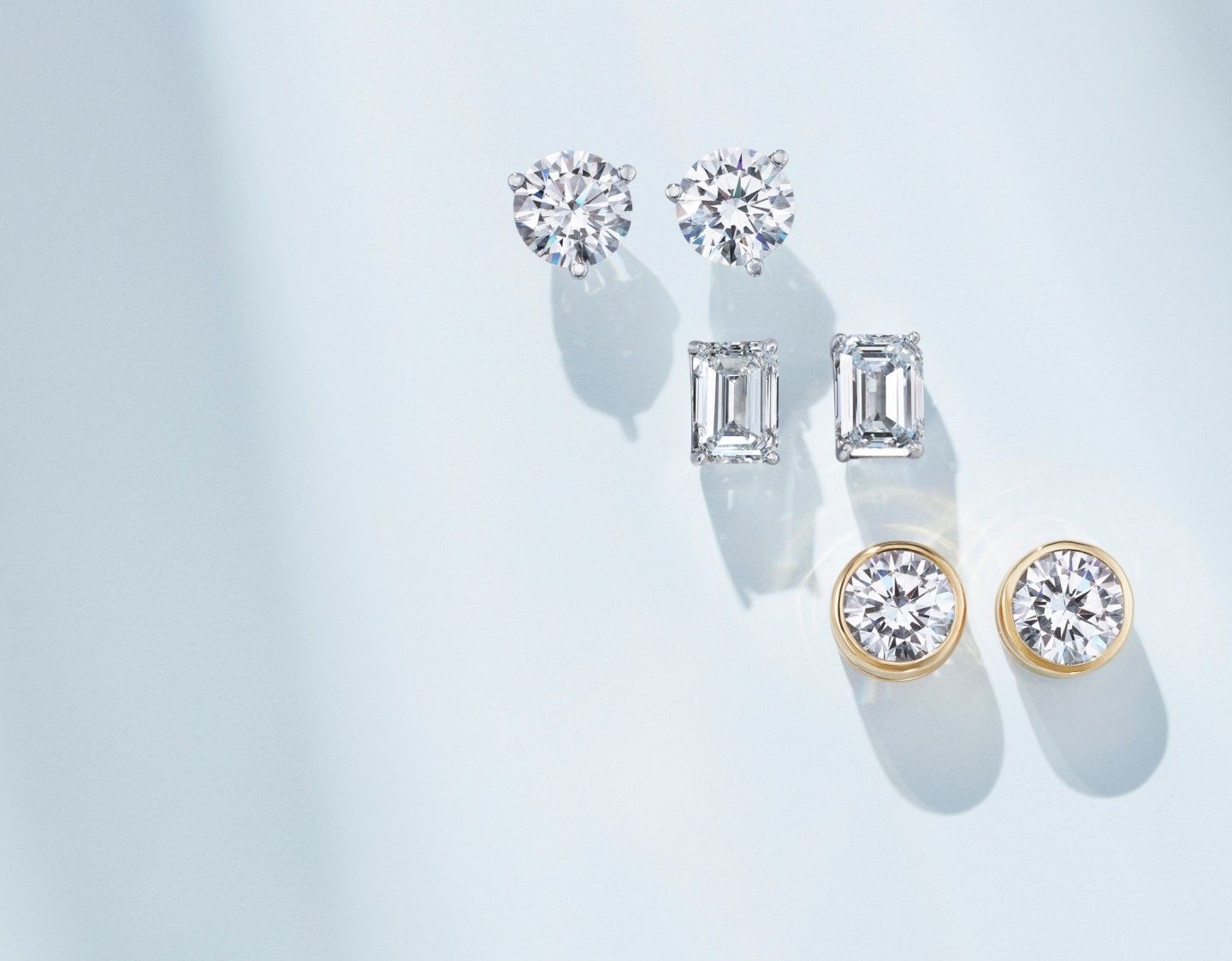Diamond stud earrings in a variety of settings.