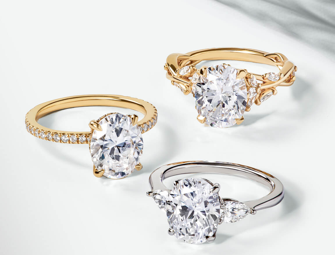 Variety of accented, oval, diamond engagement rings.