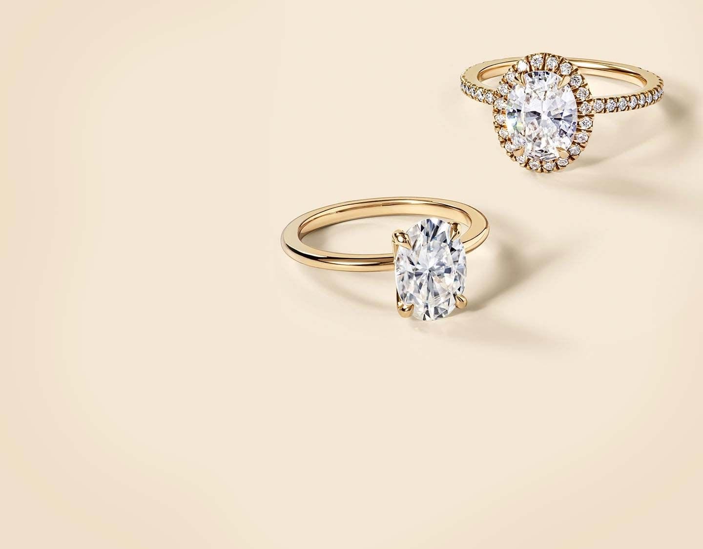 Two yellow gold moissanite rings