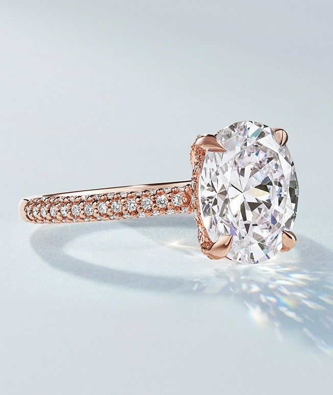 Rose gold diamond engagement ring with hidden halo.