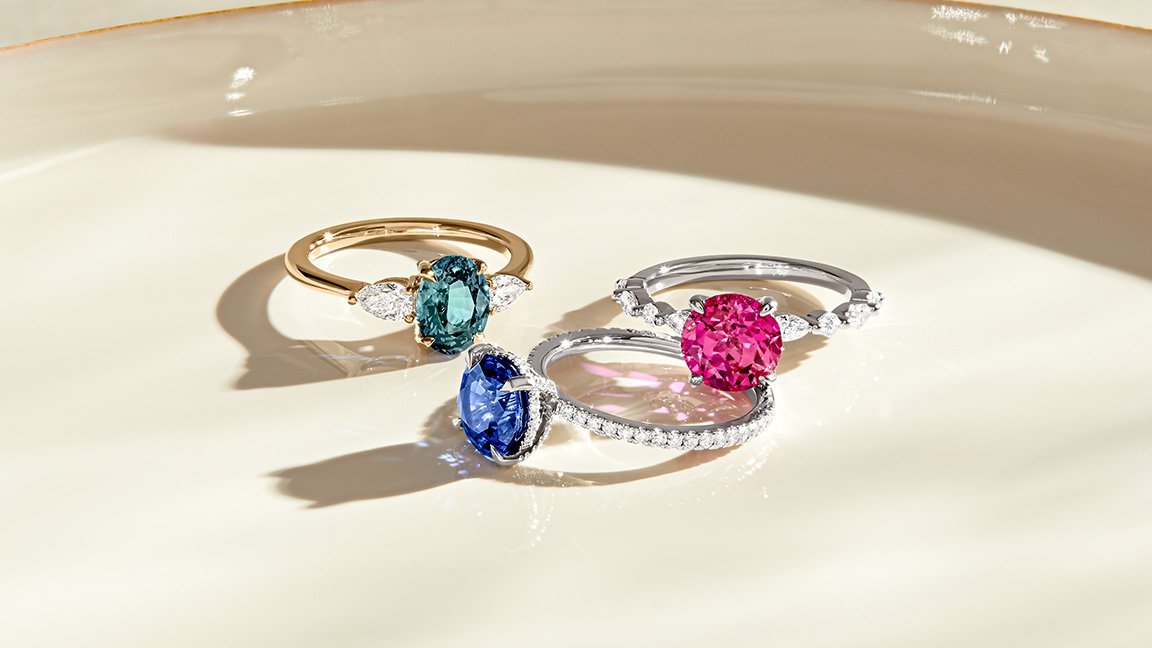 Three different colored sapphire engagement rings.