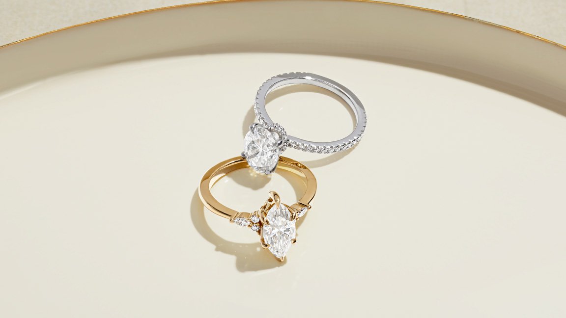 Two moissanite engagement rings.