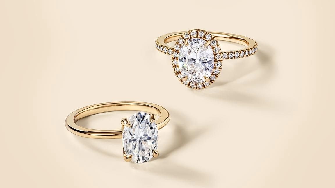 Two yellow gold moissanite engagement rings
