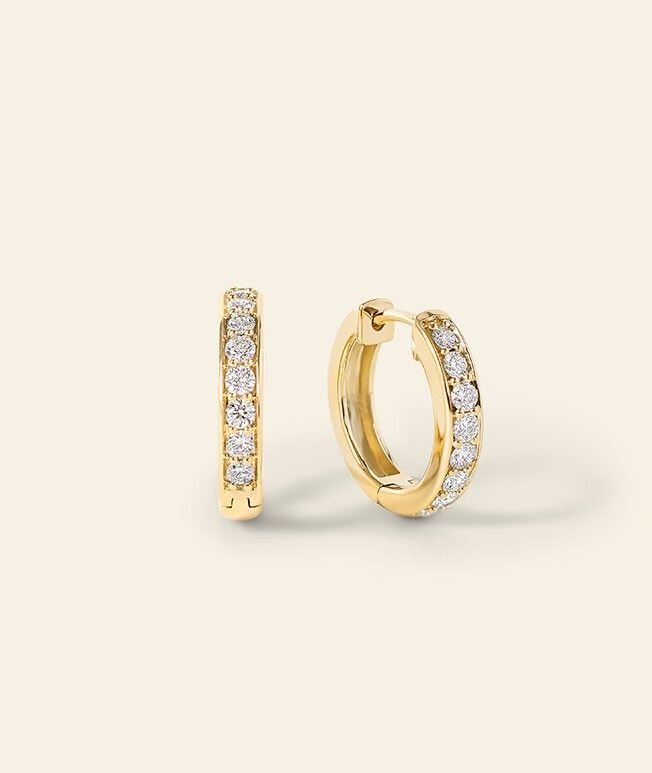 Yellow gold hoop earrings accented with diamonds