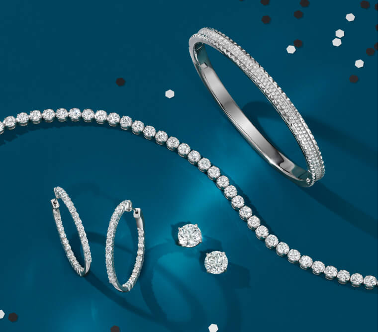 Assortment of diamond fine jewelry.