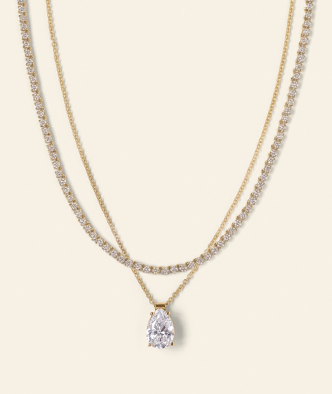 Diamond tennis necklace layered with a diamond pendent necklace
