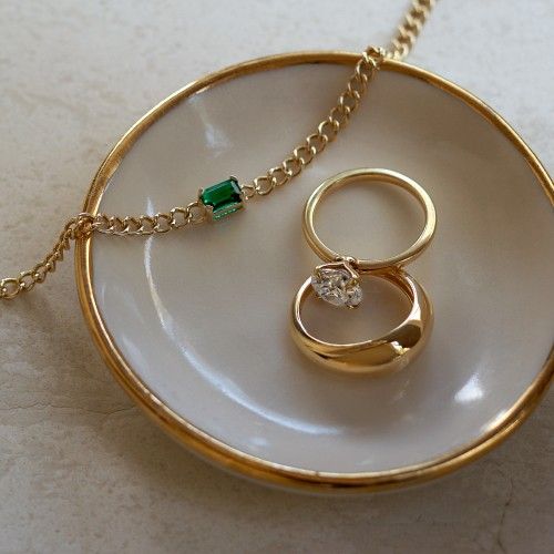 Gold diamond engagement ring, fashion ring and gemstone chain bracelet.