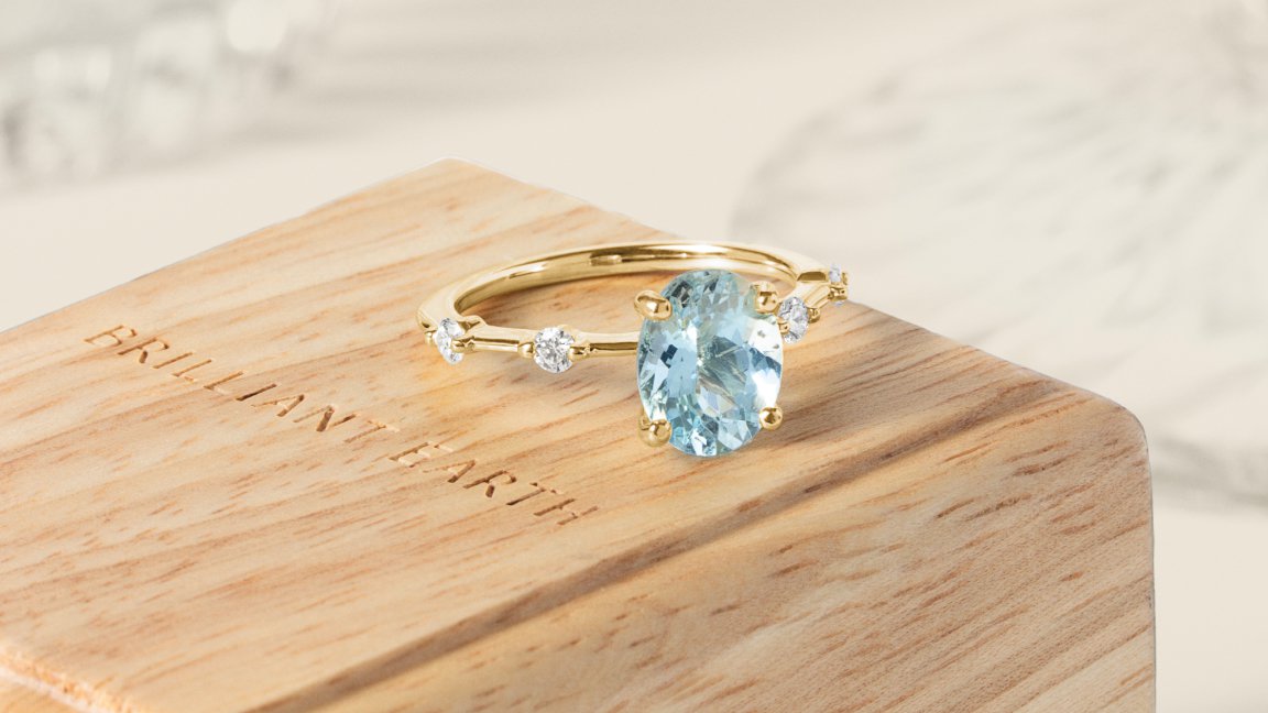 Gemstone ring on woooden jewelry box