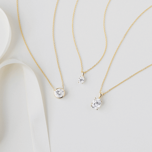Variety of solitaire diamond necklaces.