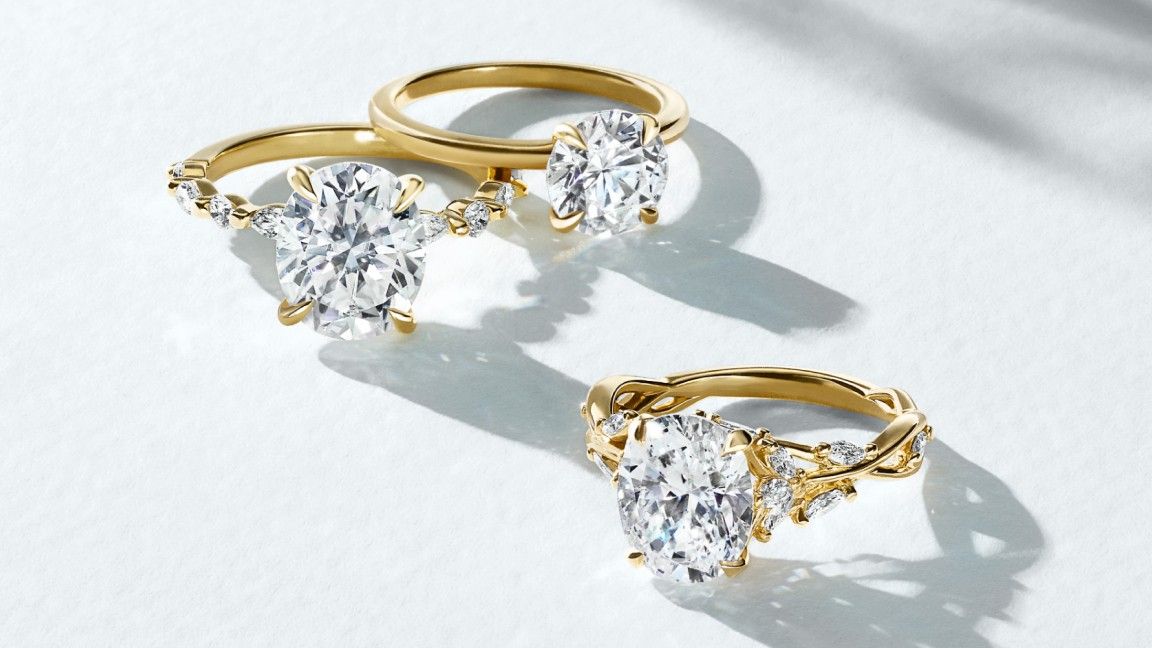 Assortment of gold diamond engagement rings.
