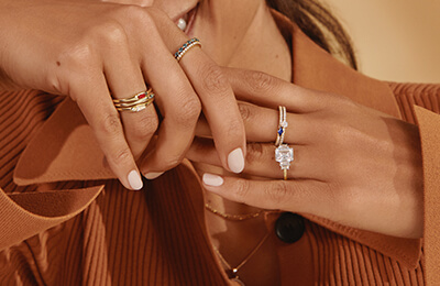 Model wearing stackable diamond fashion rings