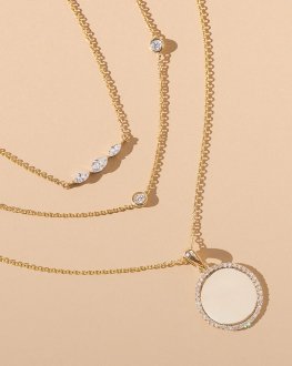 Assortment of gold, diamond necklaces.