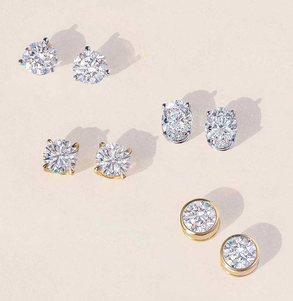 Four pairs of CYO diamond earrings
