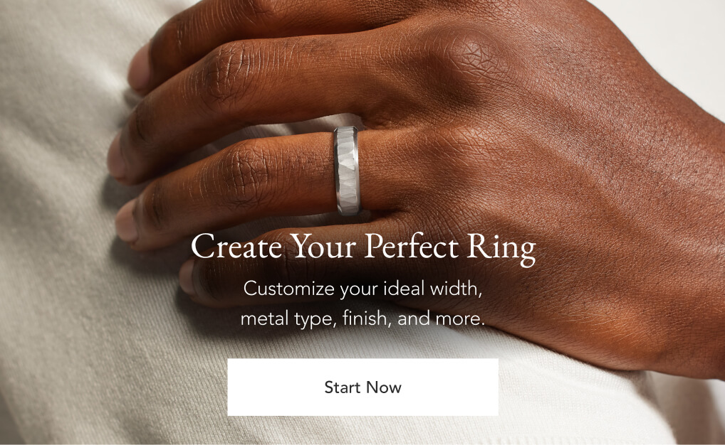 Male model wearing a custom mens wedding band.