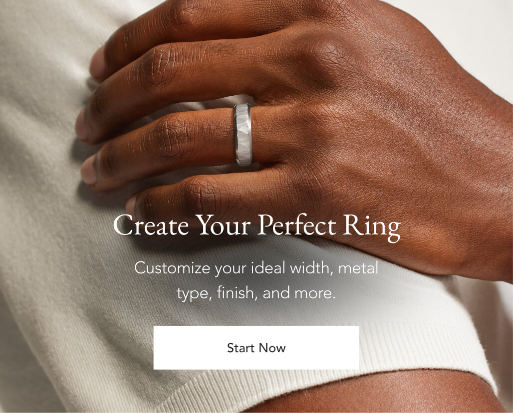 Male model wearing a custom mens wedding band.